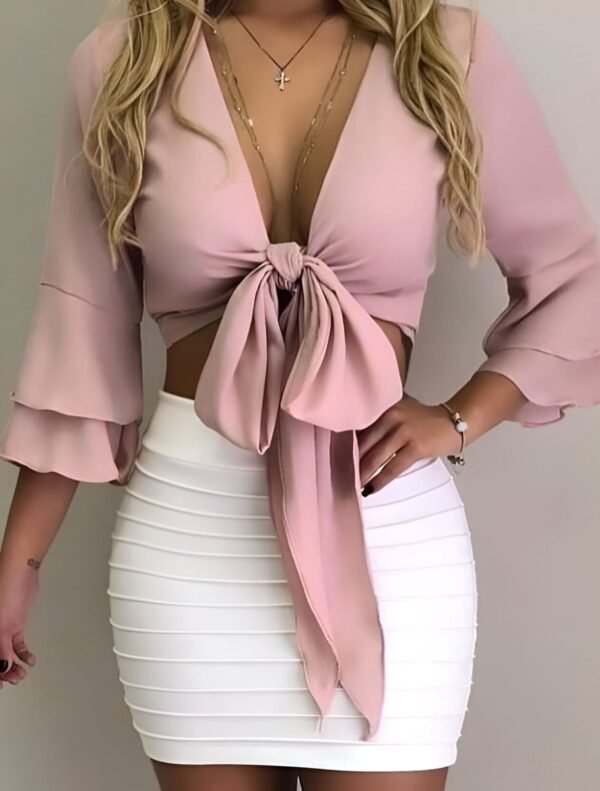 Pink bow top with long puffed sleeves and large front bow