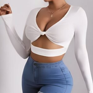 White bow top with long sleeves and a deep neckline