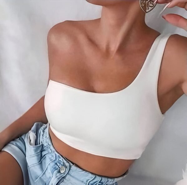 White asymmetrical one-shoulder top with thick strap and neckline