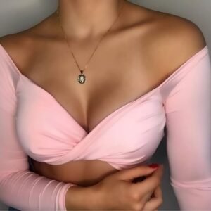 Pink bow top with long sleeves, pronounced neckline, and off-shoulder design