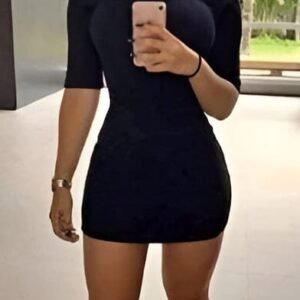 Black mini dress with 3/4 sleeves, high neck, and no neckline